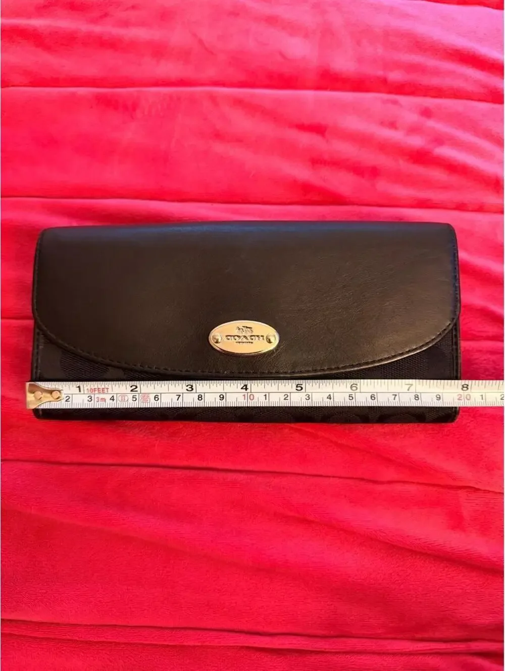 Black Coach Wallet with Silver Emblem